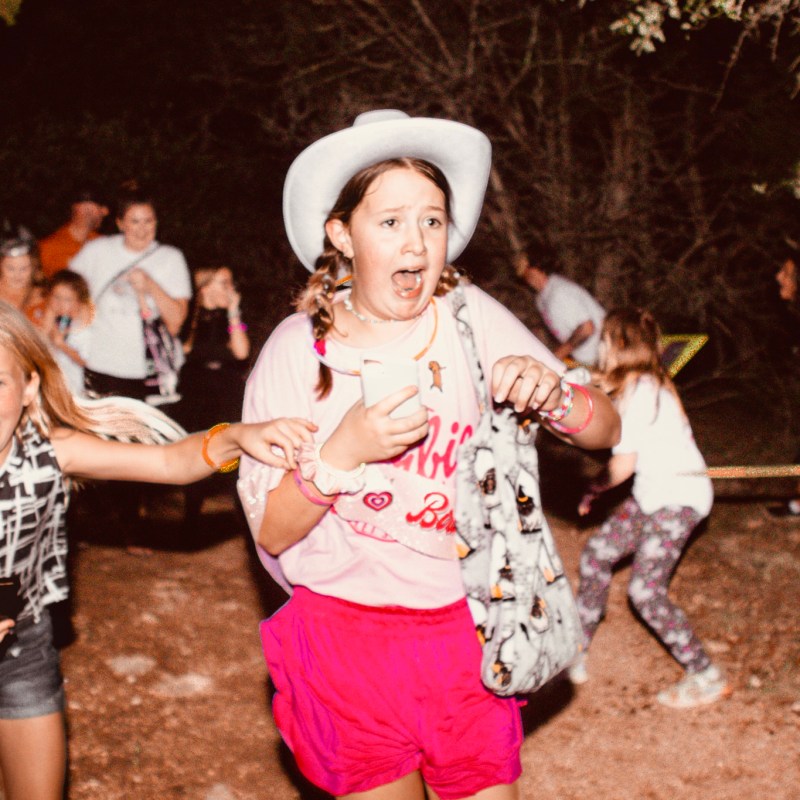 a little girl playing with a frisbee