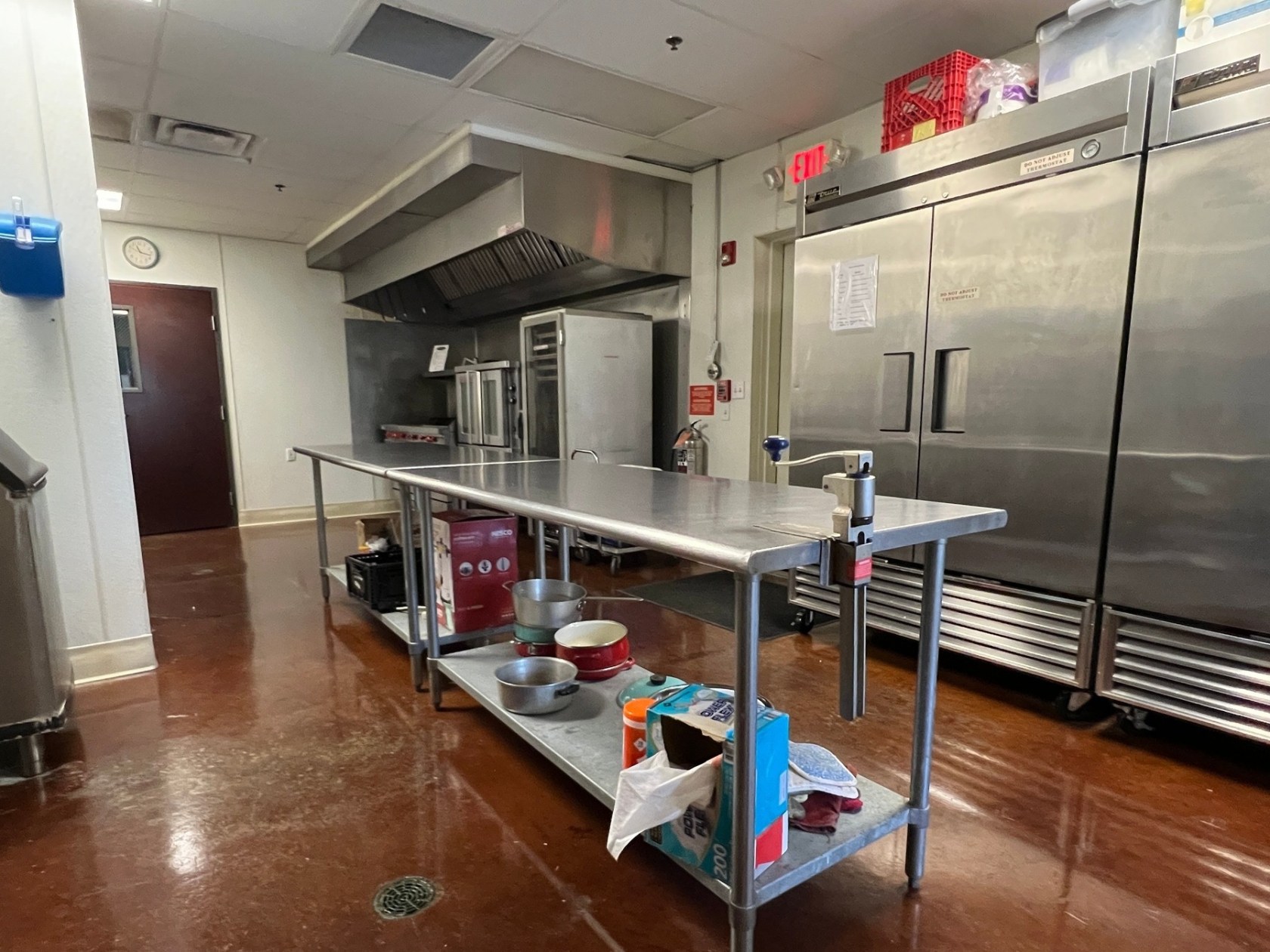 a large kitchen with stainless steel appliances