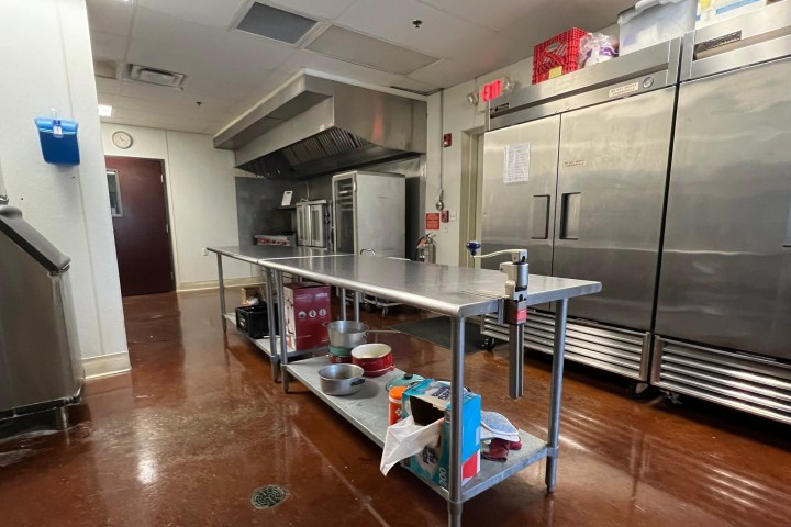 a large kitchen with stainless steel appliances