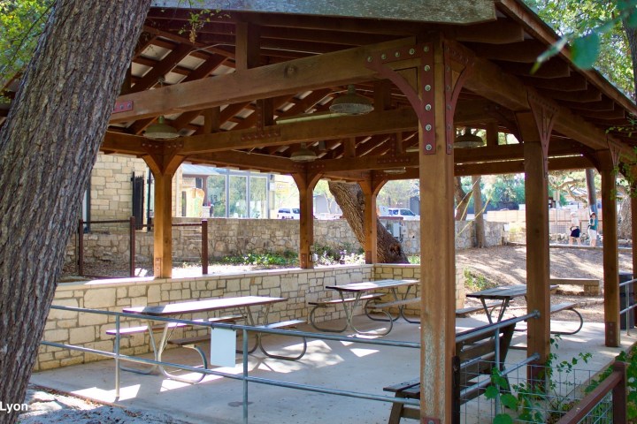 a wooden bench in front of a building