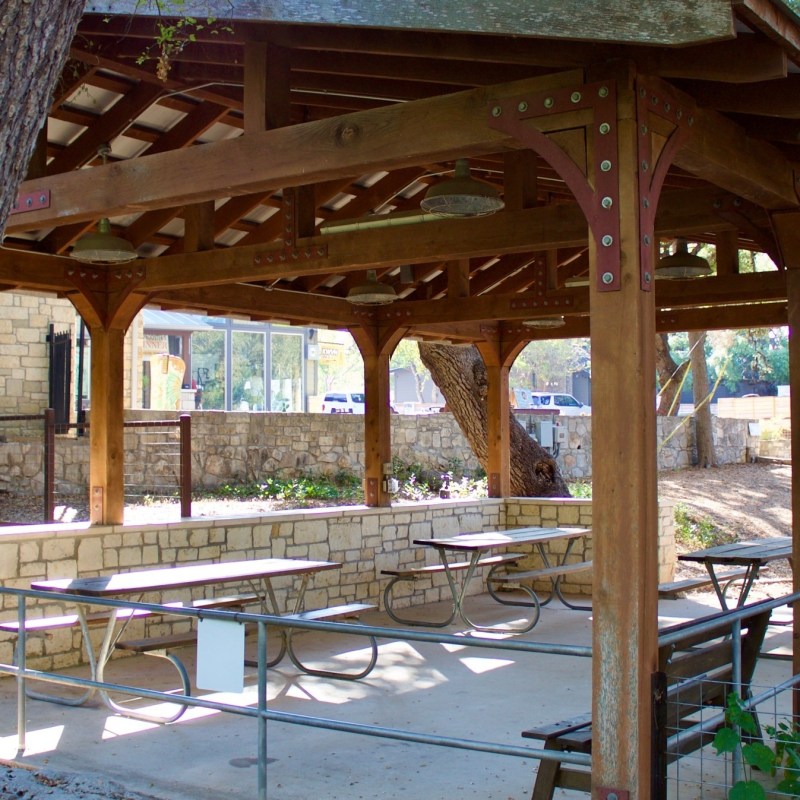 a wooden bench in front of a building