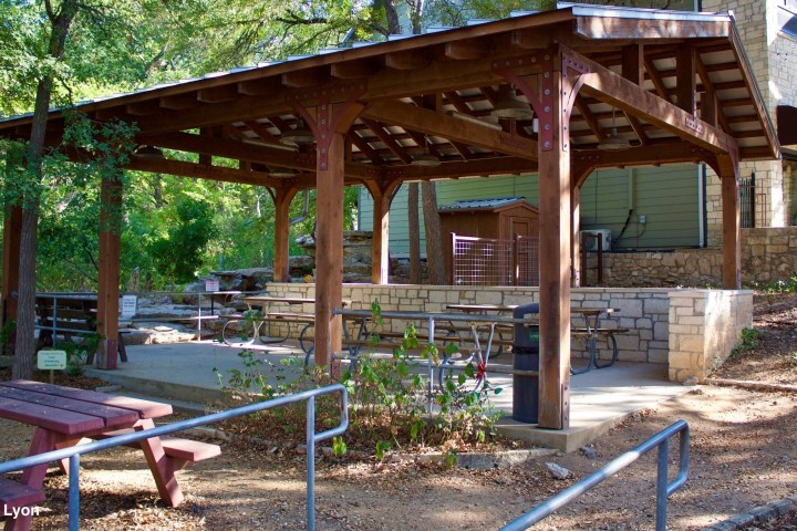 a group of lawn chairs sitting on top of a picnic table