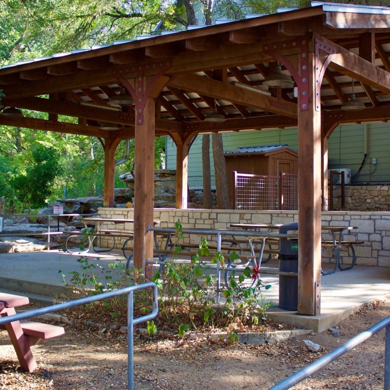 a group of lawn chairs sitting on top of a picnic table