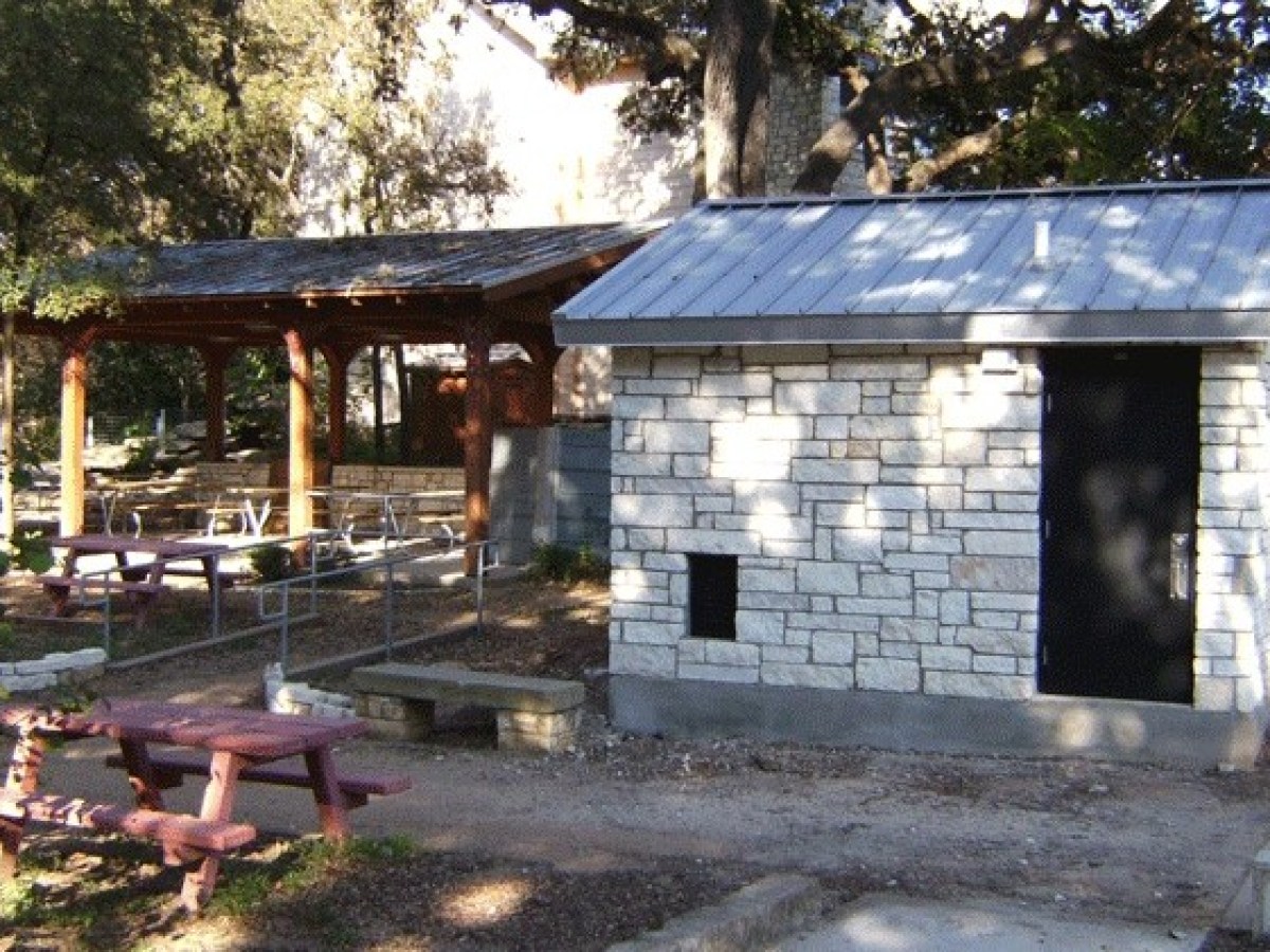 a wooden bench in front of a house