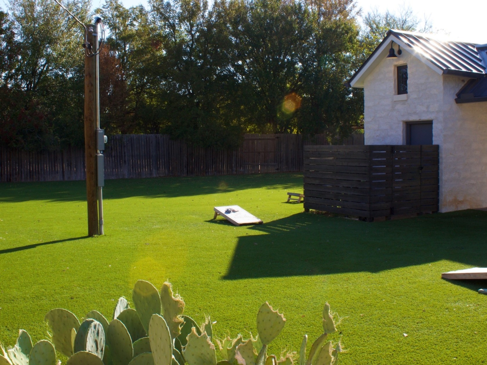 a group of lawn chairs sitting on top of a grass covered field