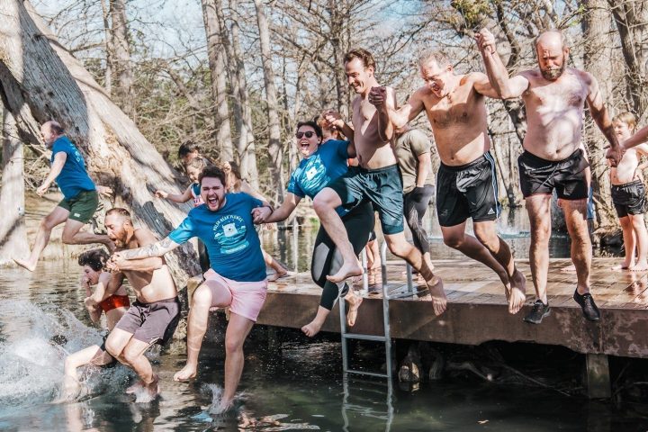 a group of people swimming in the water
