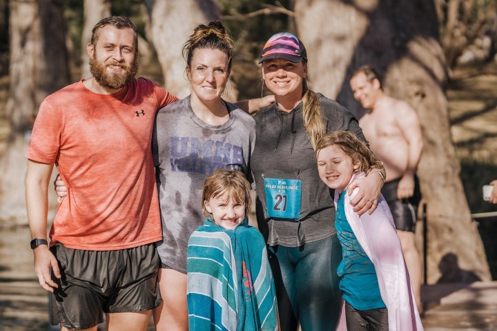 a group of people posing for the camera