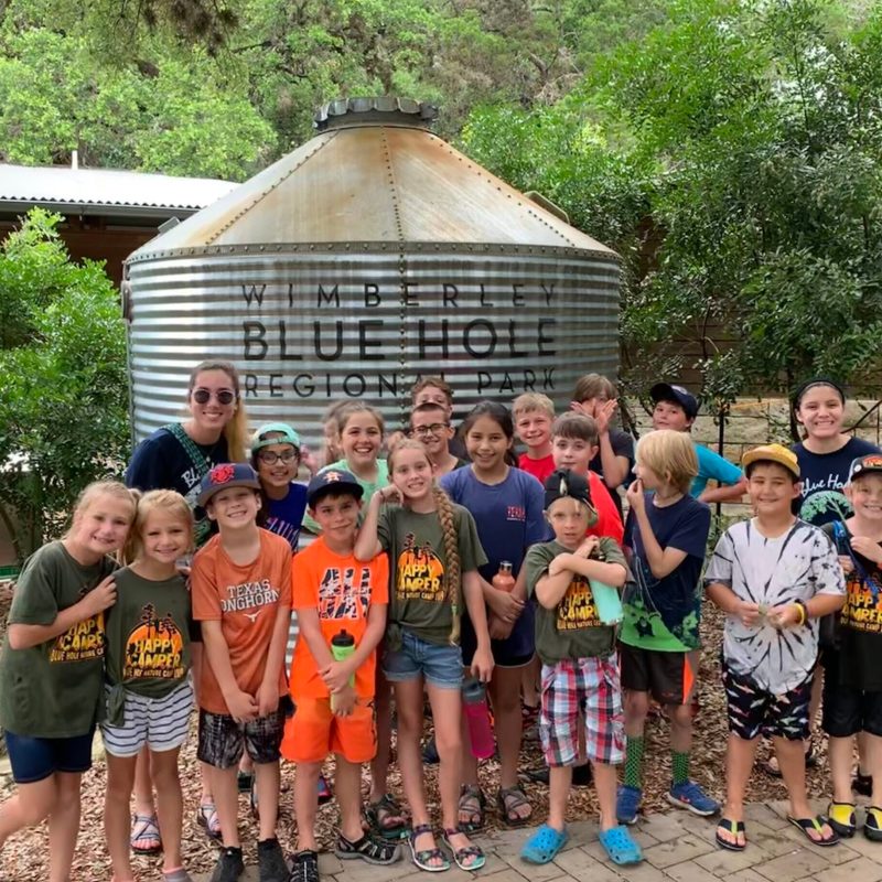a group of people standing in front of a building