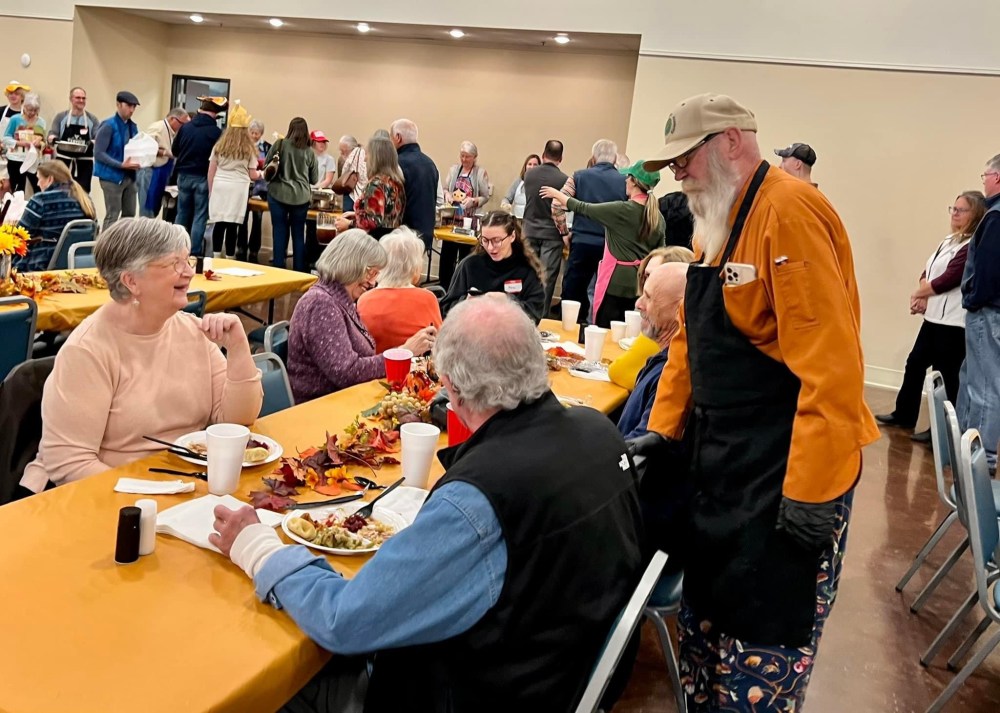 a group of people sitting at a table