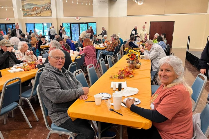 a group of people sitting at a table