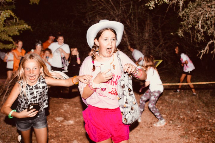 a little girl playing with a frisbee