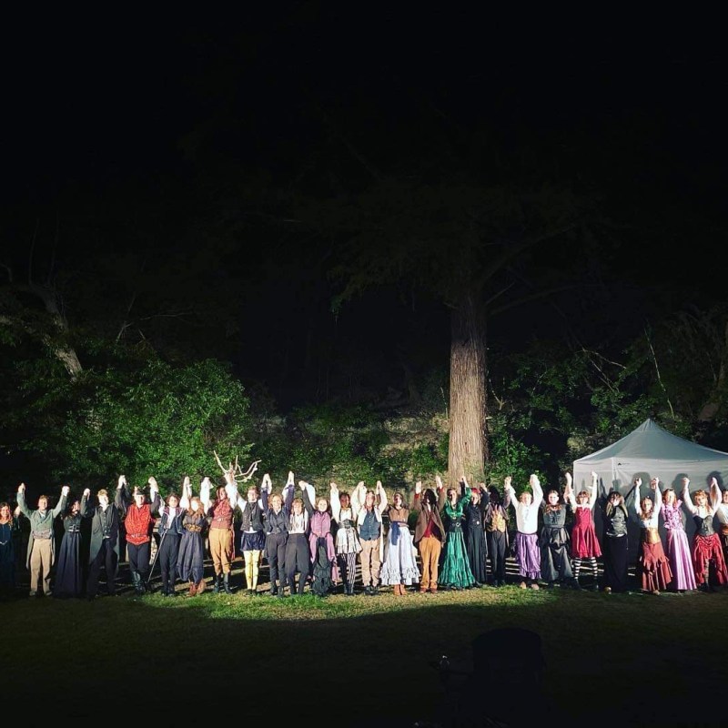 a group of people standing in front of a crowd