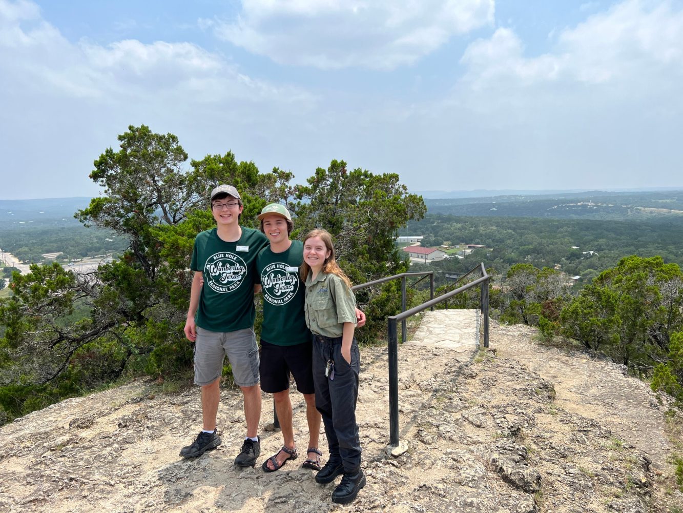 a man standing next to a body of water