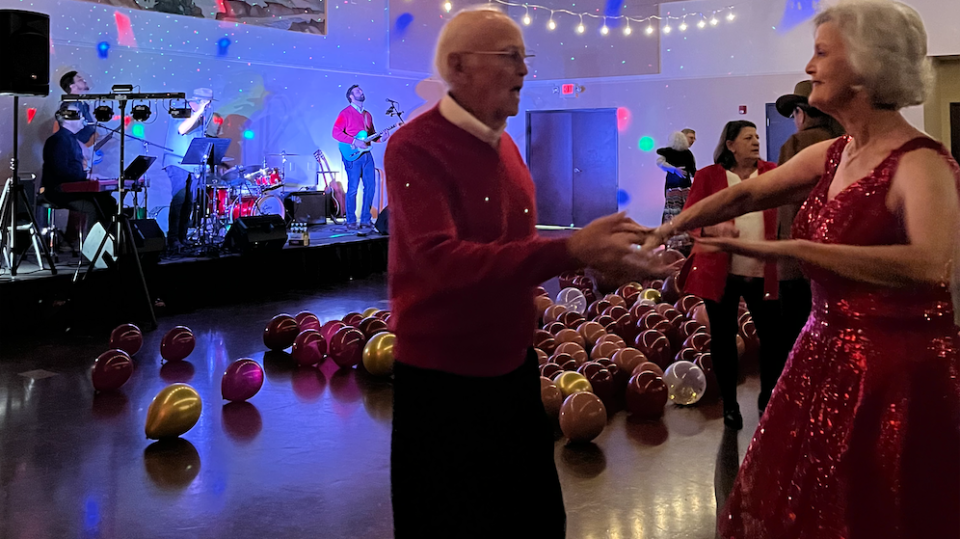 Screenshot 2024-11-04 at 4.18.28 PM a person standing on a stage in front of a crowd