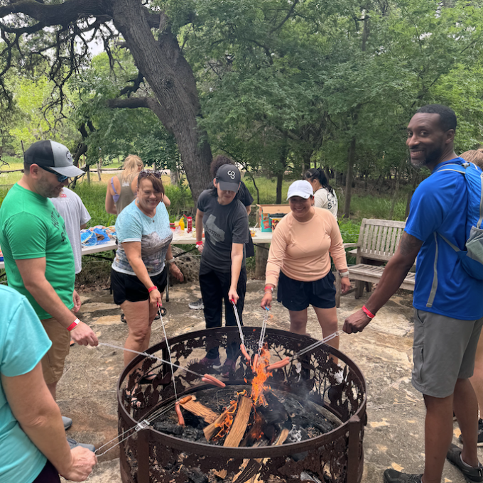 a group of people are cooking in it