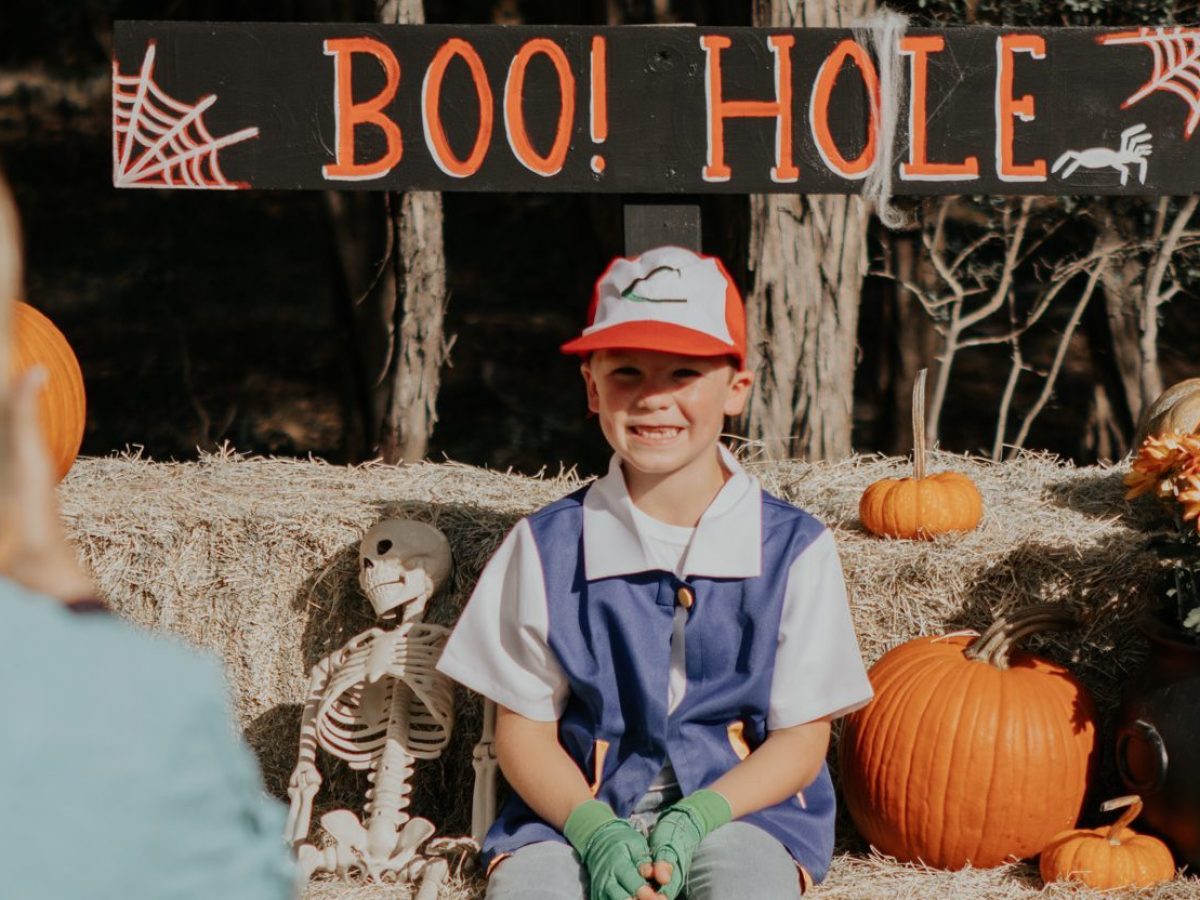 a person standing in front of a cake