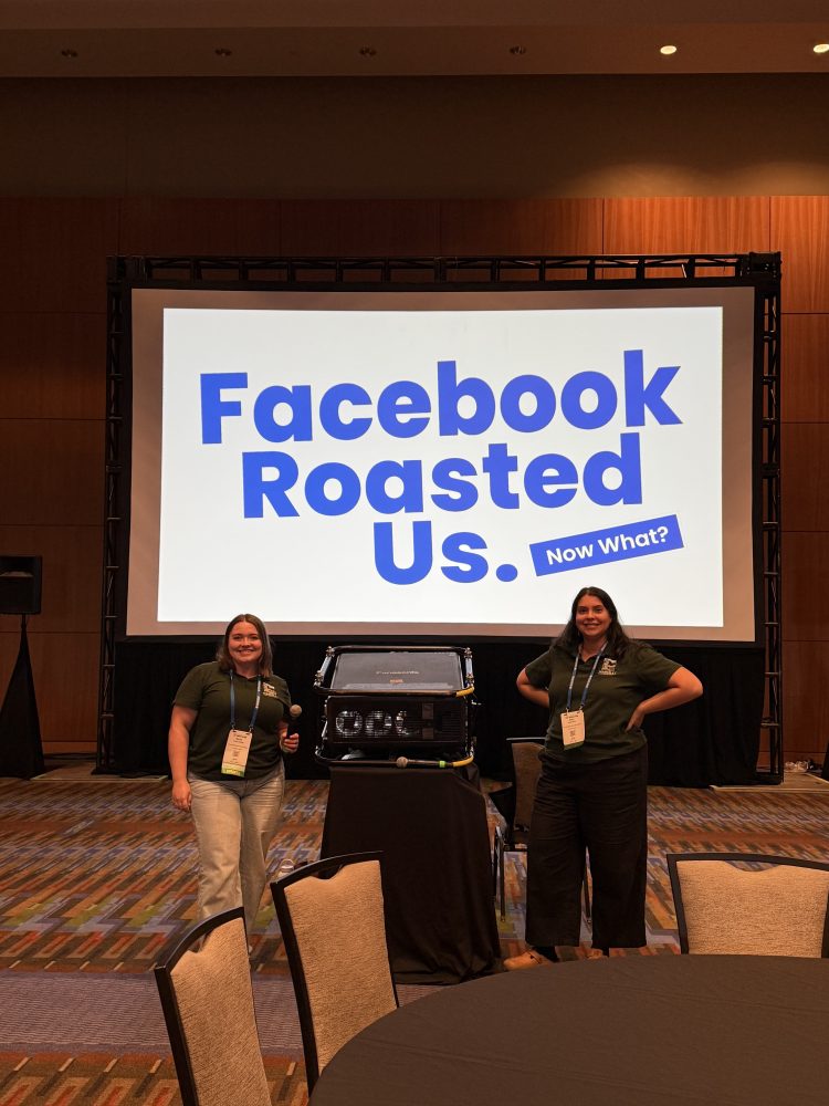 Two people stand in front of a screen with 'Facebook Roasted Us. Now What?' displayed.
